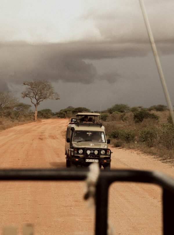 black suv on dirt road during daytime
